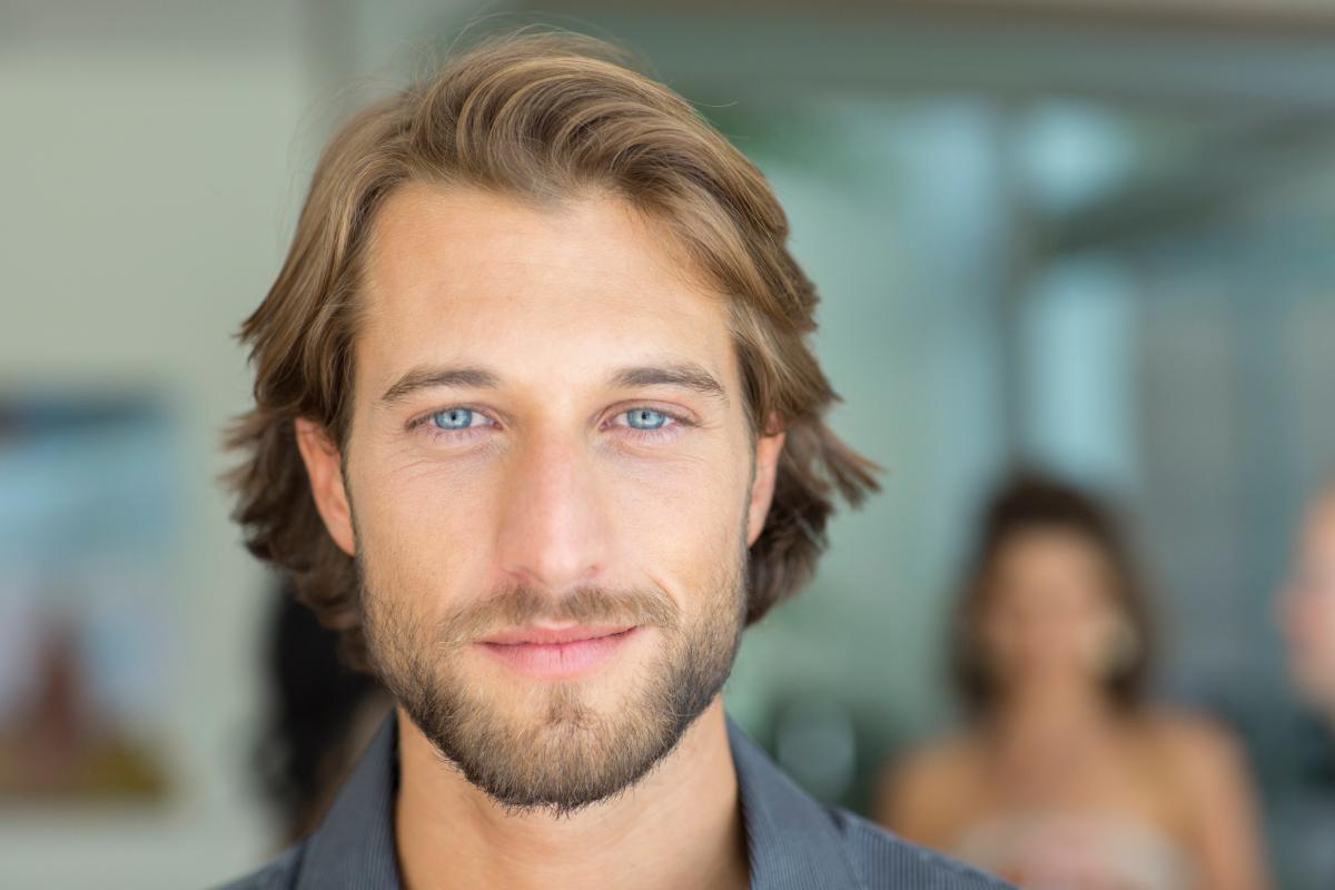 A blue eyed man looking in the distance