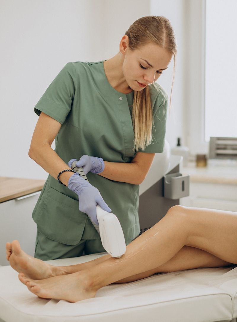 A woman receiving laser hair removal